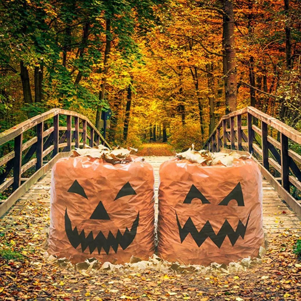 Trash bags decorated to resemble jack o'lanterns for Halloween